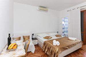 Postel nebo postele na pokoji v ubytování Lapad View Apartments
