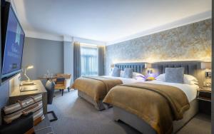 Tempat tidur dalam kamar di Kilkenny Ormonde Hotel