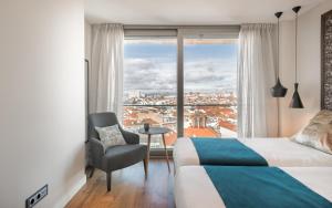 Łóżko lub łóżka w pokoju w obiekcie Gran View Apartments