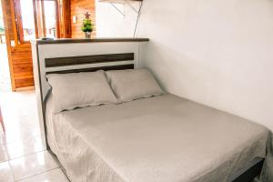 Cama ou camas em um quarto em Chales Dos Alpes