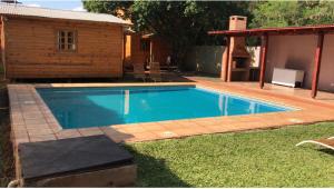 The swimming pool at or close to BUGANVILIAS LODGE