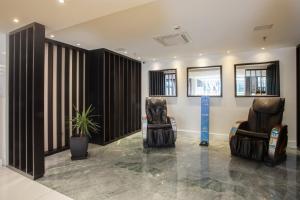 Uma área de estar em Hotel WZ Jardins