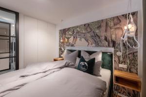 Säng eller sängar i ett rum på Ferienwohnung PARADIES am Tegernsee