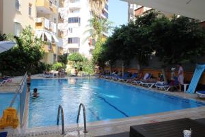 a swimming pool in the middle of a building at BIN BILLA HOTEL in Alanya