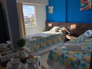 Ein Bett oder Betten in einem Zimmer der Unterkunft Novum Suites