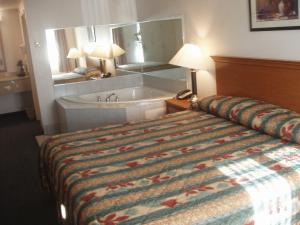 Ένα ή περισσότερα κρεβάτια σε δωμάτιο στο Kozy Inn