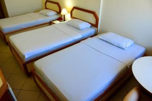 Hotel Grão Para客房内的一张或多张床位