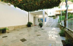 an empty courtyard of a house with a stone floor at Apartment Mate in Omiš