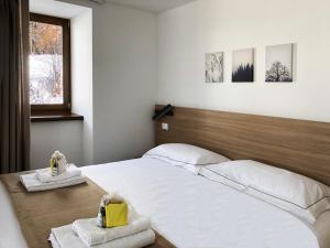 Postel nebo postele na pokoji v ubytování Residence Aurora