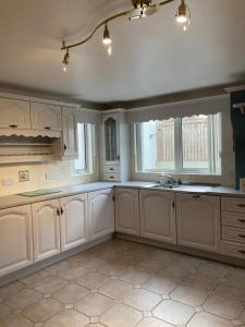 A kitchen or kitchenette at Cloneymore Self Catering House