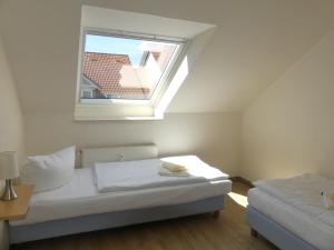 Postel nebo postele na pokoji v ubytování Apartmenthaus Binzer Sterne Haus 1