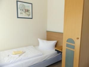 Postel nebo postele na pokoji v ubytování Apartmenthaus Binzer Sterne Haus 1