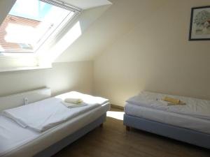 Postel nebo postele na pokoji v ubytování Apartmenthaus Binzer Sterne Haus 1