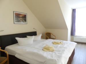 Postel nebo postele na pokoji v ubytování Apartmenthaus Binzer Sterne Haus 1