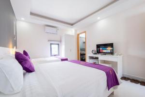 מיטה או מיטות בחדר ב-Sen Hotel Phu Quoc