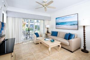 a living room with a couch and a table at Bellasera Resort in Naples