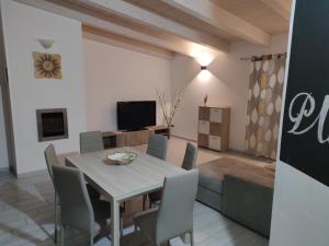 a dining room with a table and chairs at Planet apartments 1 in Montalbano Jonico