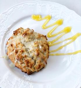 a piece of food on a white plate with yellow sauce at Beaufort House Inn in Asheville