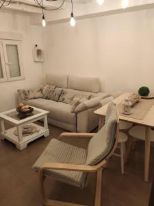 a living room with a couch and a table at Cerverahouse in Cervera de Buitrago