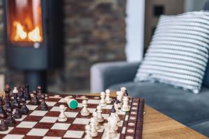 a chess game on a table in a living room at Willa Gardenia in Zakopane