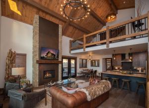 a living room with a couch and a fireplace at Relax in Luxury - Jacuzzi, Indoor/Outdoor Fireplace in Estes Park