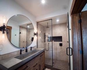 a bathroom with a sink and a mirror at Relax in Luxury - Jacuzzi, Indoor/Outdoor Fireplace in Estes Park +24 photos