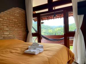 Cama ou camas em um quarto em I'Lumiar Loft