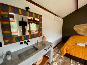 Cama ou camas em um quarto em I'Lumiar Loft