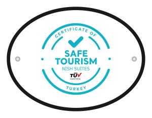 a circle certificate of safe tourism night services tiwi logo at Nish Suites Atasehir in Istanbul