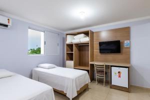 Postel nebo postele na pokoji v ubytování Hotel Baviera Iguassu