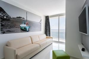 Televízia a/alebo spoločenská miestnosť v ubytovaní The Ibiza Twiins - 4* Sup