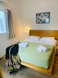מיטה או מיטות בחדר ב-Modern Cycladic Sea View House