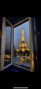 a view of the eiffel tower from a window at Eiffel Tower romantic view in Paris