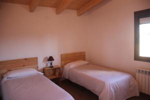 En eller flere senger på et rom på Casa Mestres