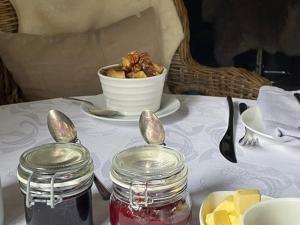 a table with a plate of food and a bowl of food at Street Farmhouse in Godshill