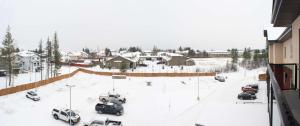 a snow covered area with cars and trucks at Best Western Plus Prince George in Prince George