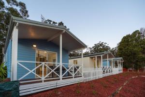 a blue manufactured home with a large porch at Tasman Holiday Parks - Myola in Myola