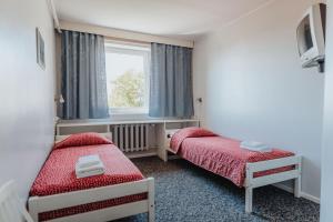 Postel nebo postele na pokoji v ubytování Staadioni Hotel