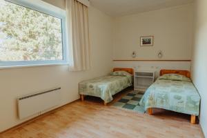Postel nebo postele na pokoji v ubytování Staadioni Hotel