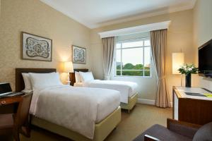 Letto o letti in una camera di Rendezvous Hotel Singapore by Far East Hospitality