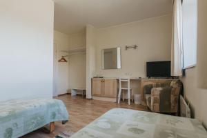 TV a/nebo společenská místnost v ubytování Staadioni Hotel