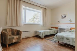 Postel nebo postele na pokoji v ubytování Staadioni Hotel + 37 fotografií