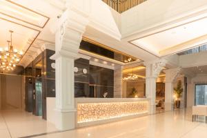 a lobby of a building with a store front at The Monarch Hotel in Calasiao