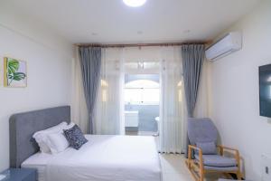 Een bed of bedden in een kamer bij 林居民宿