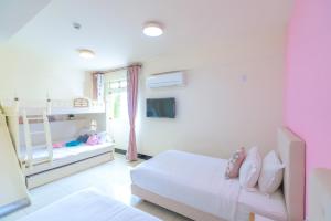 Een bed of bedden in een kamer bij 林居民宿