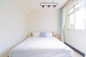 Een bed of bedden in een kamer bij 林居民宿
