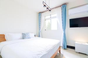 Een bed of bedden in een kamer bij 林居民宿
