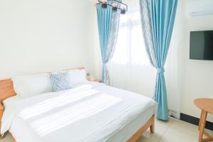 Een bed of bedden in een kamer bij 林居民宿