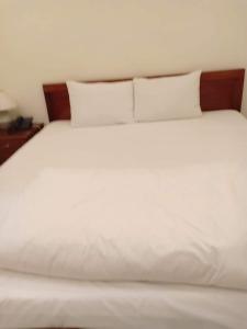 Postel nebo postele na pokoji v ubytování Nhà nghỉ Linh Quân