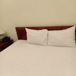 Postel nebo postele na pokoji v ubytování Nhà nghỉ Linh Quân
